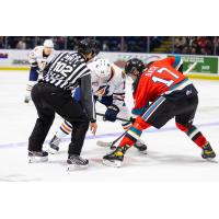 Kelowna Rockets centre Colton Dach (right) faces off with the Kamloops Blazers