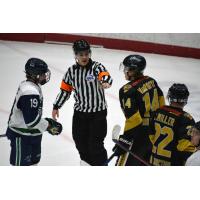 North Iowa Bulls forward Michael Mesic (left) and Bismarck Bobcats defenseman Aiden VanRooyan