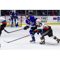 Kelowna Rockets centre Colton Dach (right) battles the Victoria Royals