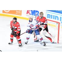 Belleville Senators defenseman Jonathan Aspirot and goaltender Mads Sogaard defend against the Rochester Americans