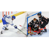 Wichita Thunder forward Stefan Fournier pokes at the puck against the Kansas City Mavericks