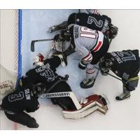 Iowa Heartlanders goaltender Corbin Kaczperski lunges for a save vs. Wheeling Nailers forward Cam Hausinger