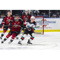 Vancouver Giants defend against the Kelowna Rockets