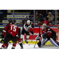 Kelowna Rockets right wing Jake Poole (center) vs. the Vancouver Giants