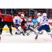 Prince George Cougars centre Koehn Ziemmer (left) vs. the Tri-City Americans