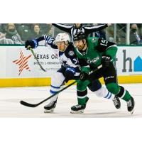 Texas Stars right wing Jeremy Gregoire (right) vs. the Manitoba Moose