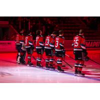 Kelowna Rockets line up before a game