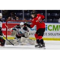 Prince George Cougars left wing Carter MacAdams vs. the Kelowna Rockets