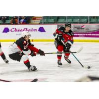 Kelowna Rockets left wing Scott Cousins (right) vs. the Prince Goerge Cougars