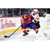 Belleville Senators centre Rourke Chartier (right) vs. the Laval Rocket