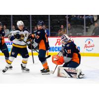 Erie Otters left wing Brendan Sellan (left) vs. the Flint Firebirds