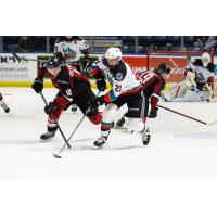 Vancouver Giants left wing Zach Ostapchuk (left) vs. the Kelowna Rockets