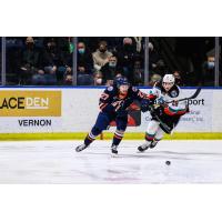 Kelowna Rockets left wing Adam Kydd (right) takes on the Kamloops Blazers