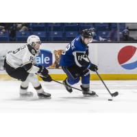 Saint John Sea Dogs centre Josh Lawrence (right) controls the puck vs. the Charlottetown Islanders
