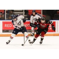 Vancouver Giants left wing Adam Hall (right) vs. the Tri-City Americans