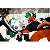 Texas Stars center Joel L'Esperance (left) faces off with the Grand Rapids Griffins