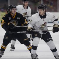 Muskegon Lumberjacks forward David Hymovitch (right) vs. the Green Bay Gamblers