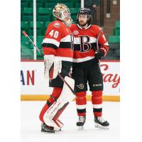 Belleville Senators goaltender Mads Sogaard (left) discusses the game