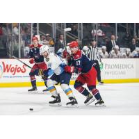 Allen Americans right wing Chad Butcher (right) vs. the Toledo Walleye