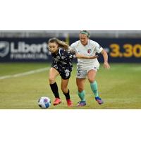 Racing Louisville FC forward Emina Ekic (left) vs. the Kansas City Current