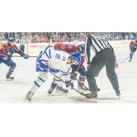 Wichita Thunder forward Carter Johnson (left) faces off with the Tulsa Oilers