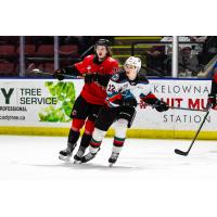 Kelowna Rockets left wing Gabriel Szturc (right) vs. the Prince George Cougars