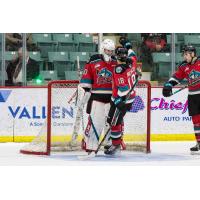 Kelowna Rockets goaltender Jari Kykkanen receives congratulations from right wing Marcus Pacheco