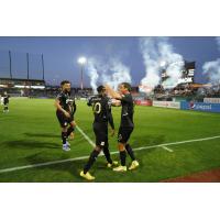 A post-goal celebration at an FC Tulsa match