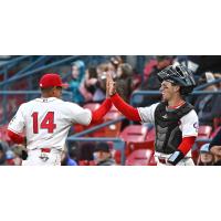 Spokane Indians pitcher Joe Rock high fives catcher Drew Romo