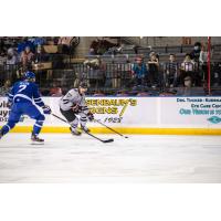 Rapid City Rush winger Stephen Baylis handles the puck