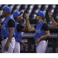 Tampa Tarpons manager Rachel Balkovec exchanges high fives with the team after a win