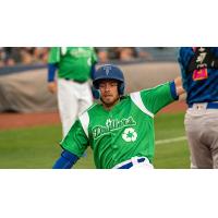 Michael Busch of the Tulsa Drillers slides into home, scoring one of his two runs for the game