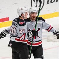 Wheeling Nailers defenseman Josh Maniscalco (left) offers congratulations