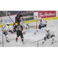 Jonny Hooker of the Prince George Cougars scores against the Kamloops Blazers