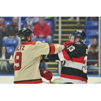 Belleville Senators defenseman Lassi Thomson (right) mixes it up with the Utica Comets