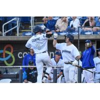 Griffin Conine of the Pensacola Blue Wahoos scores after his home run