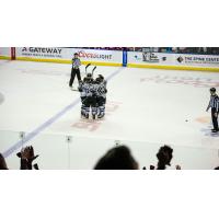 Rapid City Rush gather after a goal