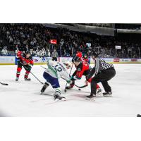 Kelowna Rockets centre Colton Dach (right) faces off with the Seattle Thunderbirds