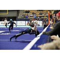Massachusetts Pirates make a tackle against the Iowa Barnstormers