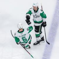 Texas Stars defenseman Ben Gleason and center Ty Dellandrea exchange fist bumps