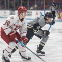 Muskegon Lumberjacks forward Owen Mehlenbacher (right) vs. the Dubuque Fighting Saints