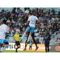 Las Vegas Lights FC defender Dekel Keinan goes high for a ball against Monterey Bay FC