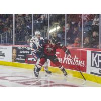 Vancouver Giants right wing Justin Lies (right) vs. Mats Lindgren of the Kamloops Blazers