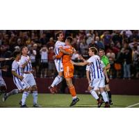 Louisville City FC rushes the field after advancing past Detroit City FC