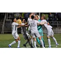 The San Jose Earthquakes celebrate goalkeeper Matt Bersano's game-winning goal in the penalty shootout