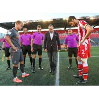 CPL Commissioner Mark Noonan conducts the coin toss as Atlético Ottawa takes on Forge FC