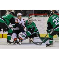 Coachella Valley Firebirds' Austin Poganski battles Texas Stars' Ryan Shea, Matthew Murray and Tanner Kero
