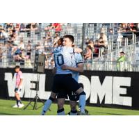 Atlético Ottawa's Oliver Jacob Bassett celebrates win