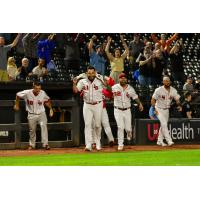 Louisville Bats exit the dugout following a victory