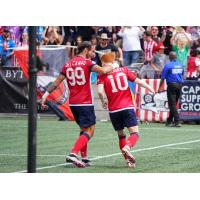 Atlético Ottawa attacker Rubén del Campo Ferreira congratulates midfielder Ollie Bassett after his goal against Valour FC